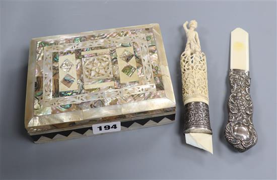 A mother of pearl trinket box and a carved ivory silver mounted handle and a silver handle
